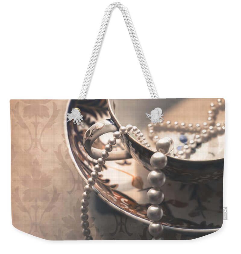 Cup And Saucer Weekender Tote Bag featuring the photograph Teacup and Pearls by Jan Bickerton