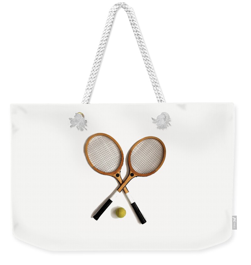 Activity Weekender Tote Bag featuring the photograph Vintage wooden tennis rackets and tennis ball by Tom Conway