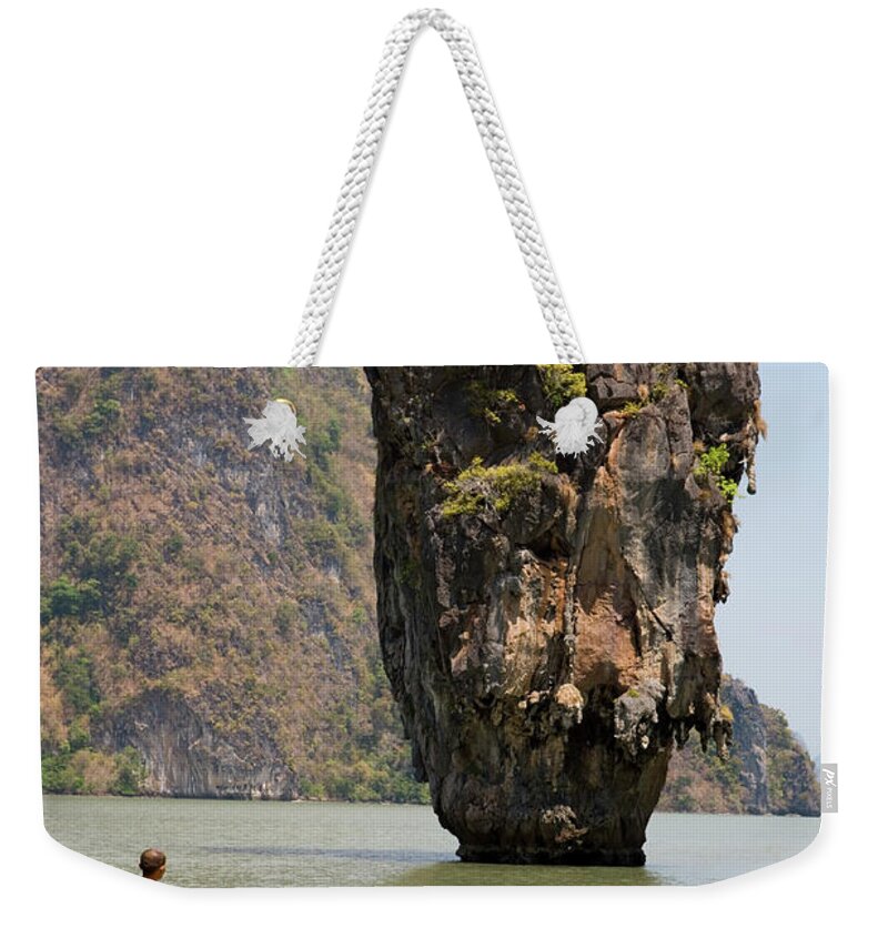 Southeast Asia Weekender Tote Bag featuring the photograph Thai Monk At Ko Phing Kan James Bond by Holger Leue