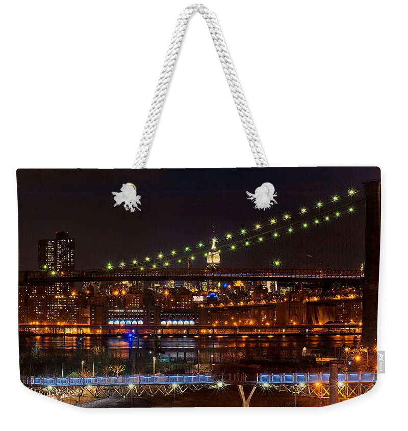 Amazing Brooklyn Bridge Photos Weekender Tote Bag featuring the photograph The Empire State Building Framed by the Brooklyn Bridge by Mitchell R Grosky