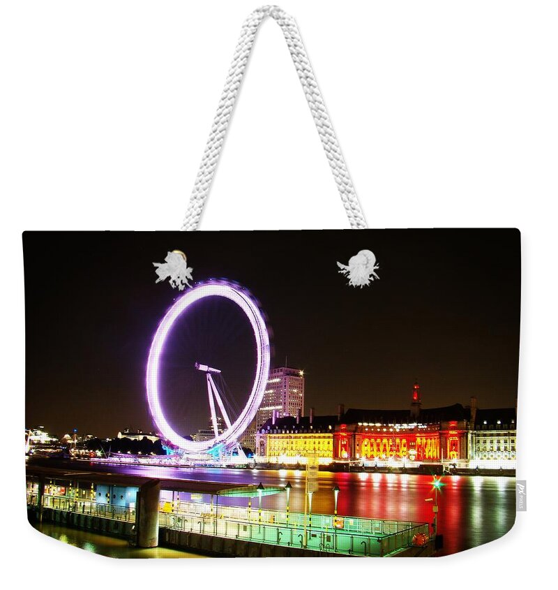 The London Eye Weekender Tote Bag featuring the photograph The Eye in Colors by Zinvolle Art