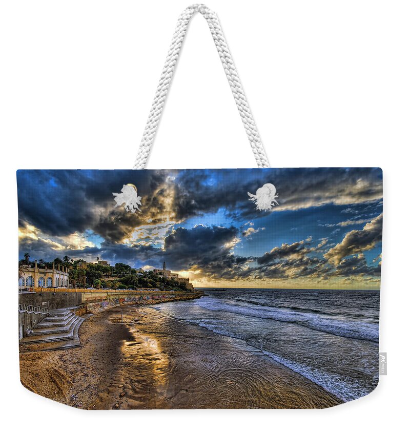 Israel Weekender Tote Bag featuring the photograph the golden hour during sunset at Israel by Ronsho