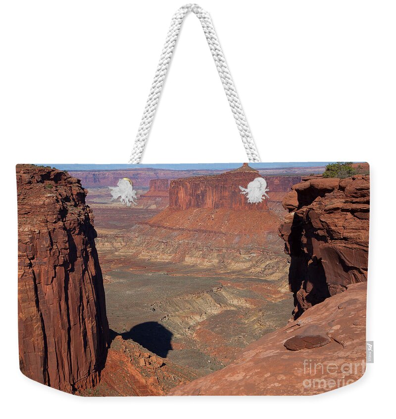 Canyonlands Weekender Tote Bag featuring the photograph His Eye is on the Sparrow by Jim Garrison
