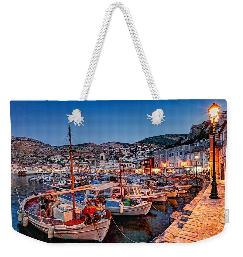 Aegean Weekender Tote Bag featuring the photograph The harbor of Hydra by night - Greece by Constantinos Iliopoulos