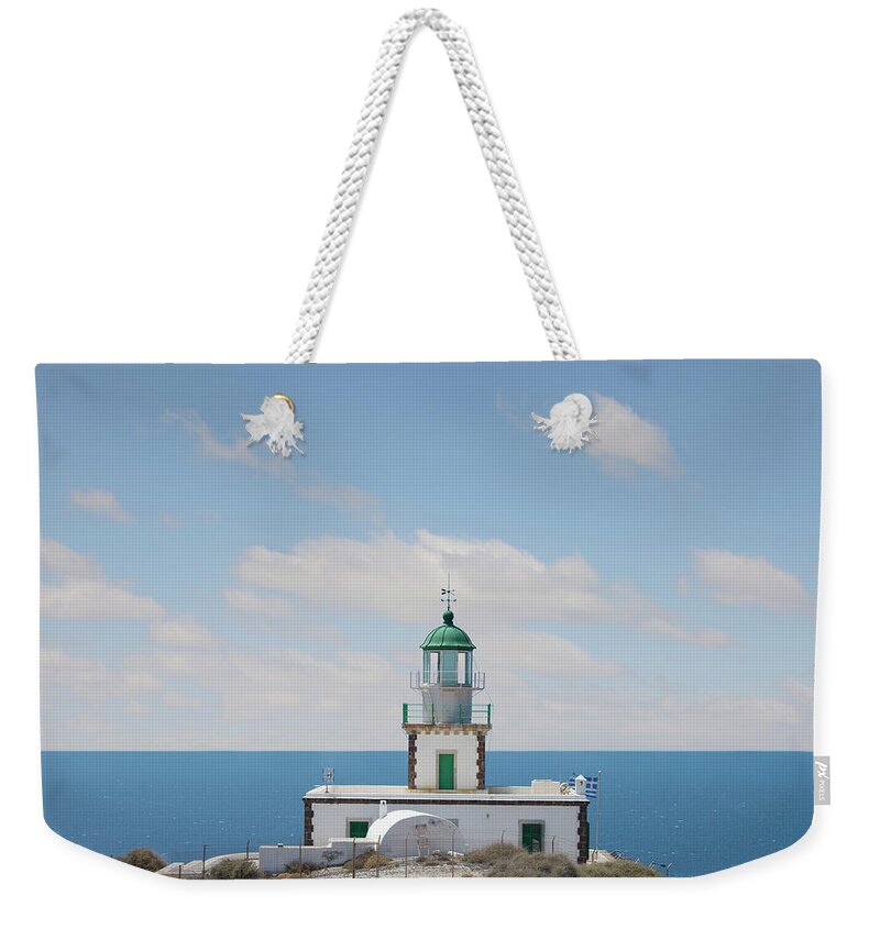 Tranquility Weekender Tote Bag featuring the photograph The Lighthouse At Akrotiri, Santorini by Ed Freeman