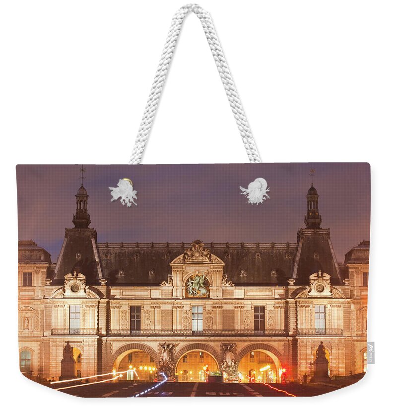 Ile-de-france Weekender Tote Bag featuring the photograph The Louvre Museum Lit Up At Night by Julian Elliott Photography