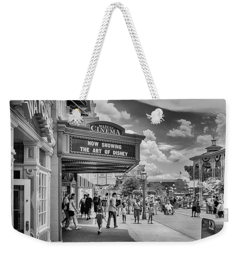 Disney Weekender Tote Bag featuring the photograph The Main Street Cinema by Howard Salmon