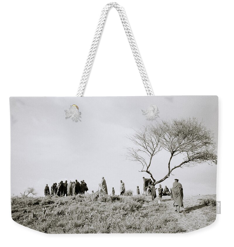 Masai Mara Weekender Tote Bag featuring the photograph The Masai Village by Shaun Higson