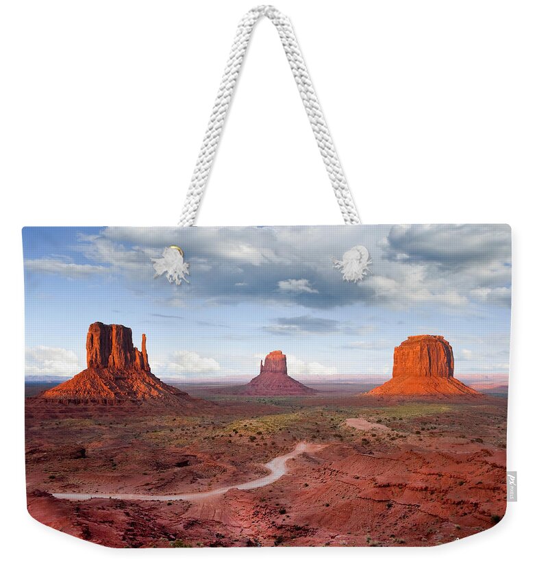 Arizona Weekender Tote Bag featuring the photograph The Mittens and Merrick Butte at Sunset by Jeff Goulden