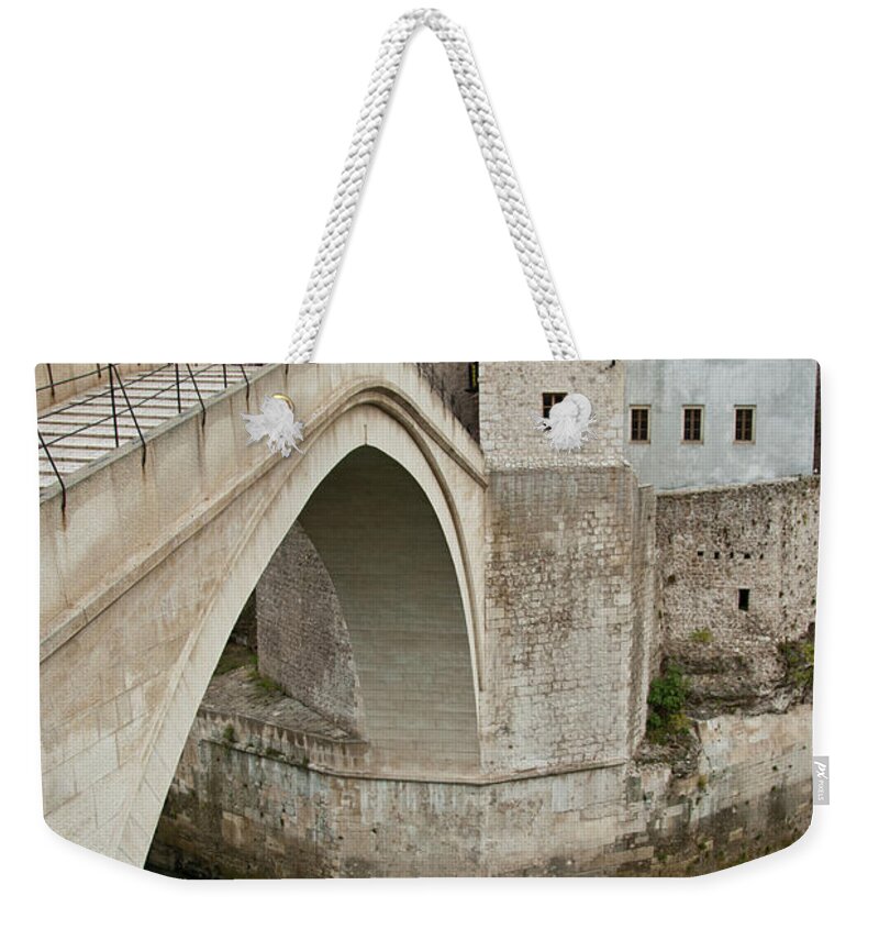 And Weekender Tote Bag featuring the photograph The New Old Bridge Over The Neretva by Guillem Lopez