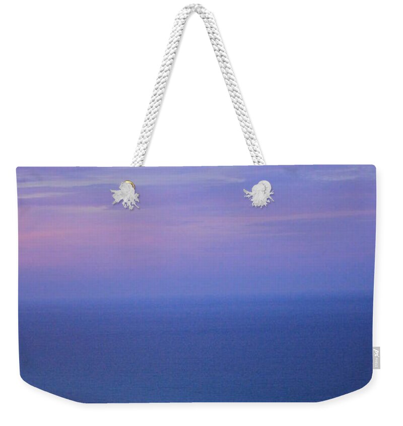 Blue Weekender Tote Bag featuring the photograph Aww the beauty of the ocean off the Emerald Coast of Florida by Jennifer E Doll