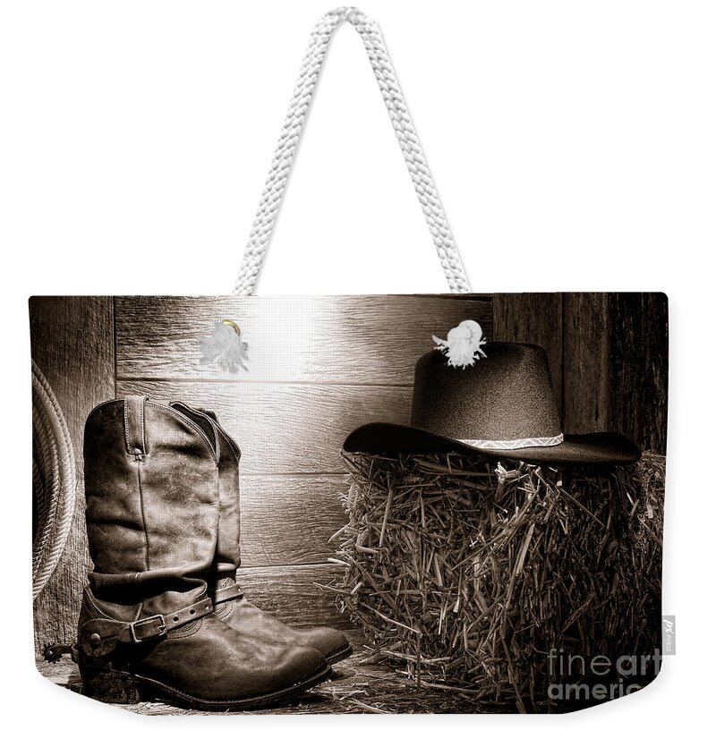 Western Weekender Tote Bag featuring the photograph The Old Boots by Olivier Le Queinec