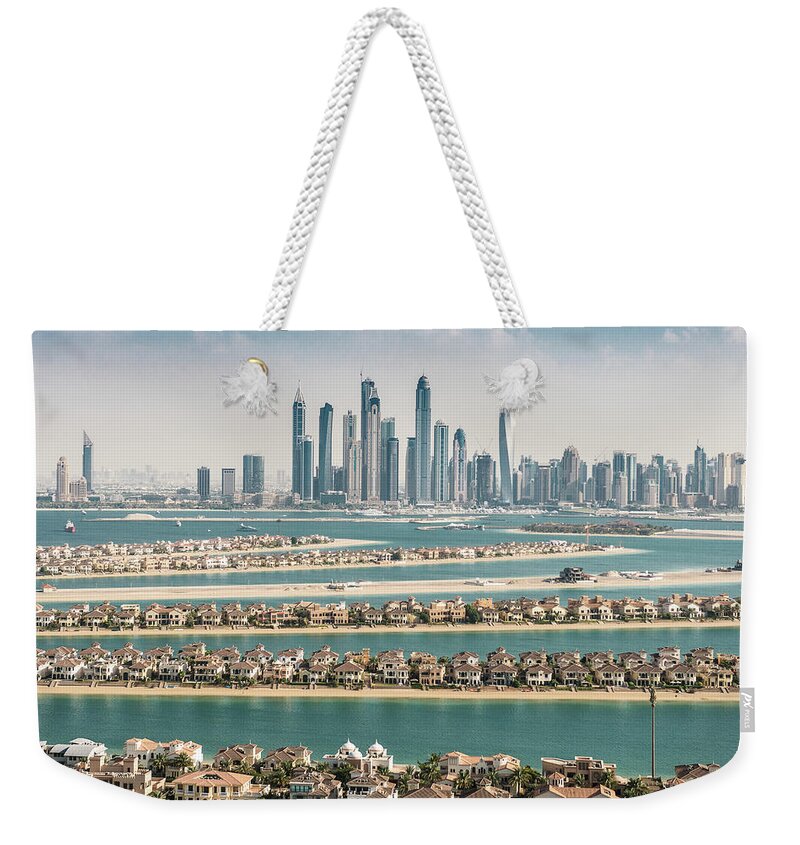 Panoramic Weekender Tote Bag featuring the photograph The Palm Jumeirah In Dubai With Skyline by Franckreporter