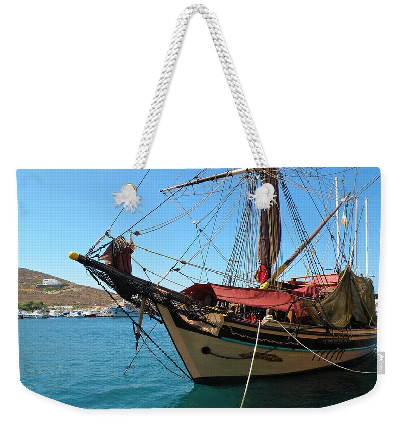 Ios Weekender Tote Bag featuring the photograph The Pirate Ship by Micki Findlay