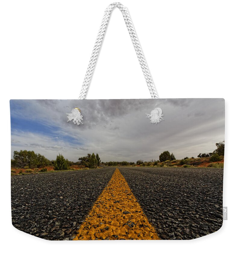 Deserted Road Weekender Tote Bag featuring the photograph The road less traveled by Jonathan Davison