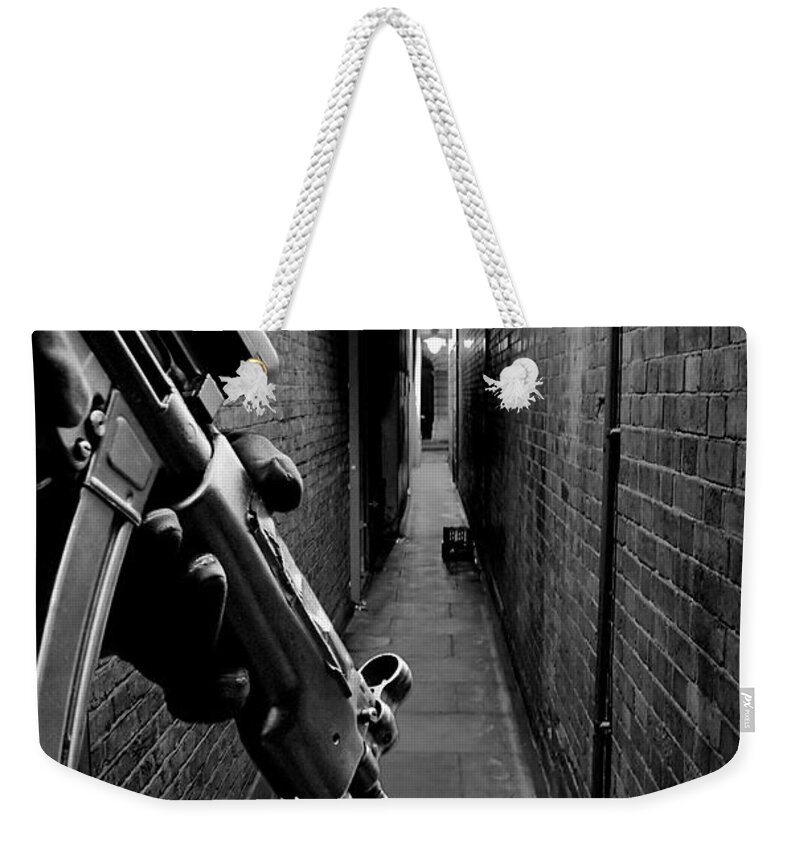 Machine Gun Weekender Tote Bag featuring the photograph The Search is On by Jasna Buncic