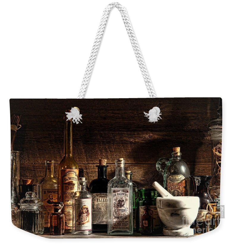 Apothecary Weekender Tote Bag featuring the photograph The Snake Oil Shop by Olivier Le Queinec