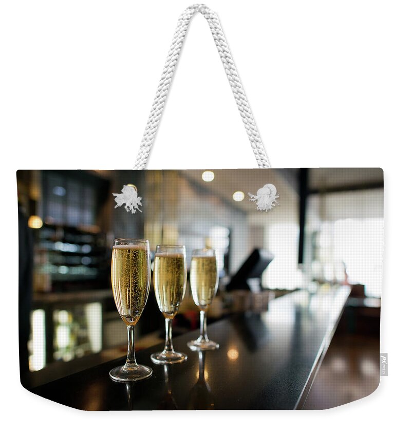 Alcohol Weekender Tote Bag featuring the photograph Three Champagnes by Helen Yin