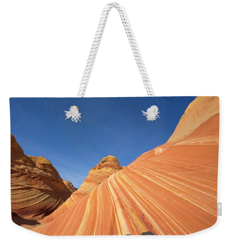 00345465 Weekender Tote Bag featuring the photograph Tired Hiker Paria Wilderness Arizona by Yva Momatiuk John Eastcott