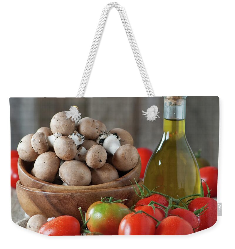 Heap Weekender Tote Bag featuring the photograph Tomato And Mushrooms by Oxana Denezhkina