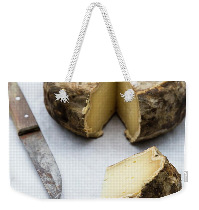 Cheese Weekender Tote Bag featuring the photograph Tomme De Savoie Cheese And Knife On by Westend61
