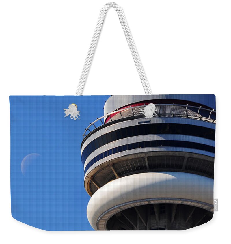 Toronto Weekender Tote Bag featuring the photograph Toronto CN Tower Moon and Jet Trail by Ursa Davis