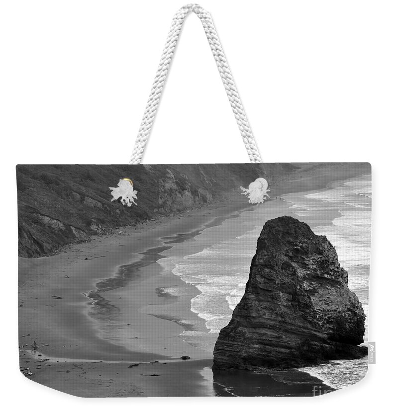 Beach Photographs Weekender Tote Bag featuring the photograph Towering Rock by Kirt Tisdale