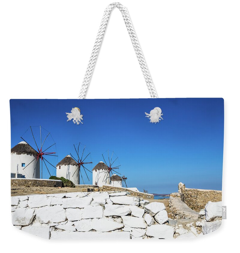 Environmental Conservation Weekender Tote Bag featuring the photograph Traditional Windmills Of Mykonos by Deimagine