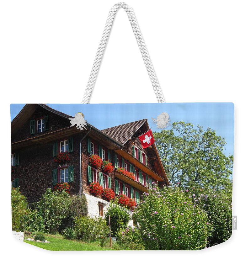 Architecture Weekender Tote Bag featuring the photograph Traditional wooden Swiss House by Amanda Mohler