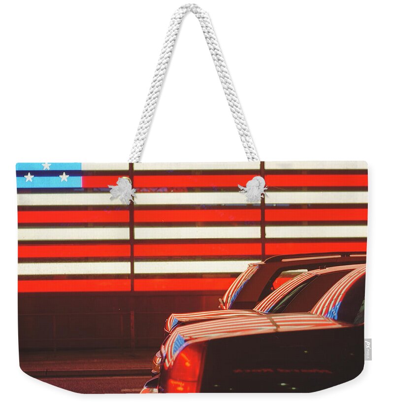 Outdoors Weekender Tote Bag featuring the photograph Traffic On Road With American Flag by Alberto Cassani