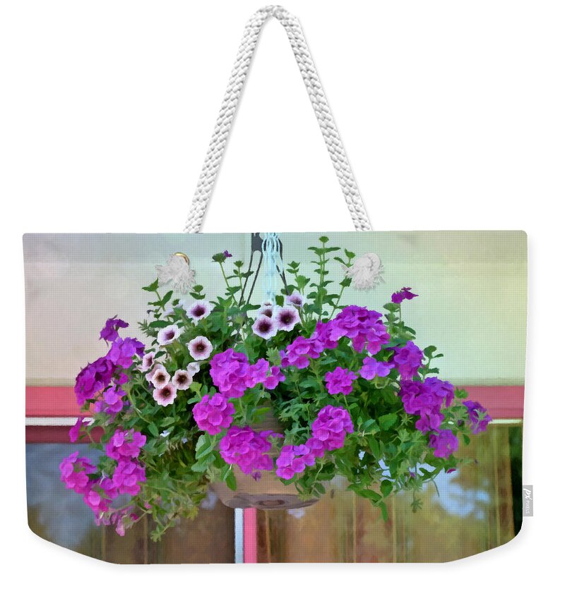 Trailing Petunia Flowers In A Hanging Basket Weekender Tote Bag featuring the painting Trailing petunia flowers in a hanging basket by Jeelan Clark