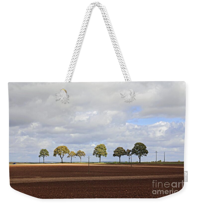 Tree Line France Trees Row French Countryside Landscape Rural Farmland Agriculture Weekender Tote Bag featuring the photograph Tree line France by Julia Gavin