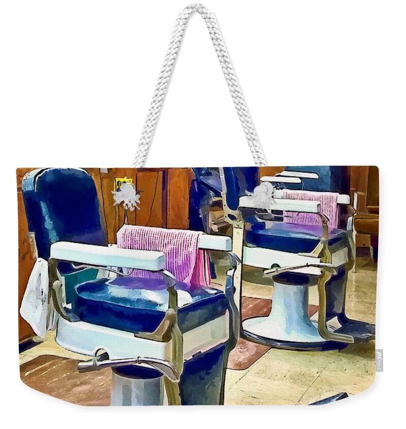 Barber Shop Weekender Tote Bag featuring the photograph Two Barber Chairs With Pink Striped Barber Capes by Susan Savad