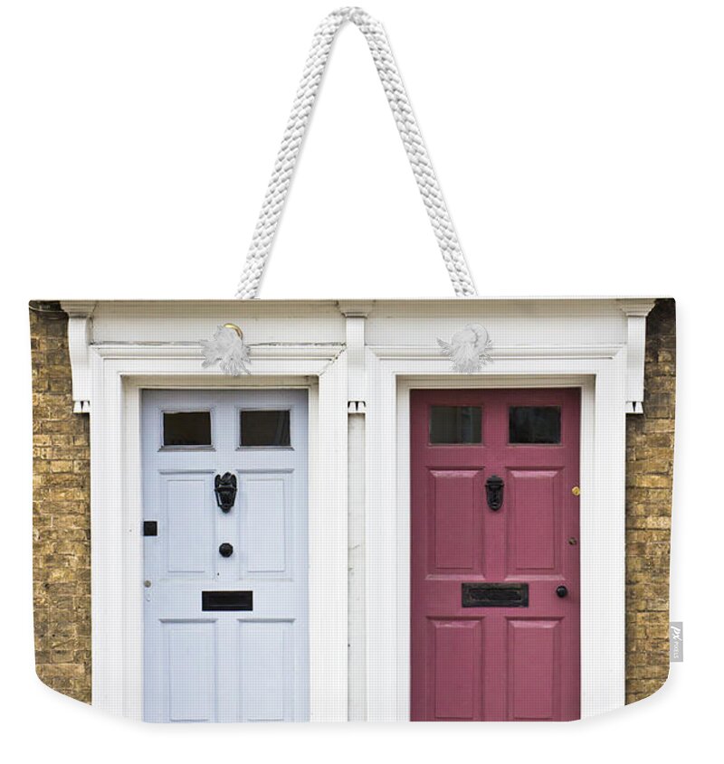 Accommodation Weekender Tote Bag featuring the photograph Two doors by Tom Gowanlock