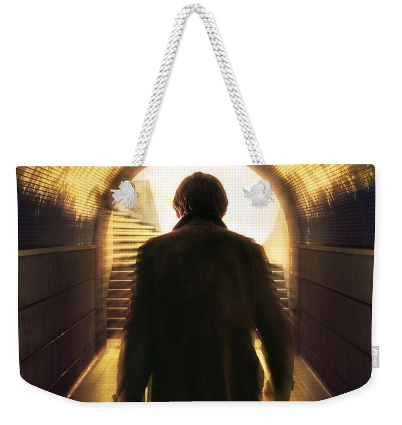 Atmospheric Weekender Tote Bag featuring the photograph Underpassing Man by Carlos Caetano