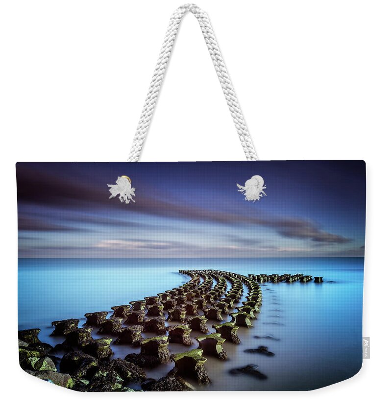 Scenics Weekender Tote Bag featuring the photograph Unusual Sea Defenses At Felixstowe by Stevendocwra