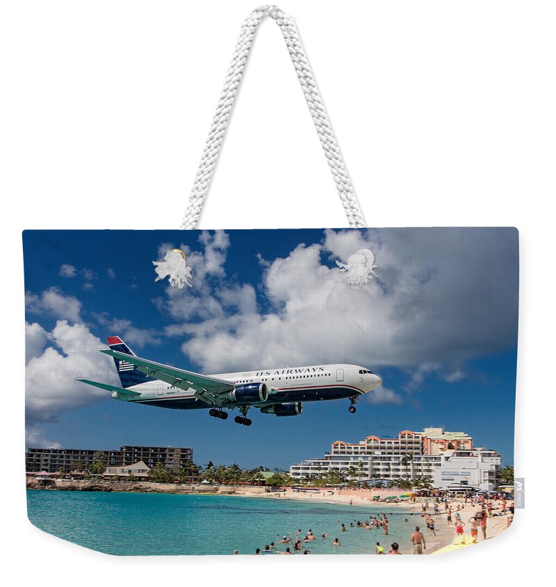 Us Weekender Tote Bag featuring the photograph U S Airways landing at St. Maarten by David Gleeson