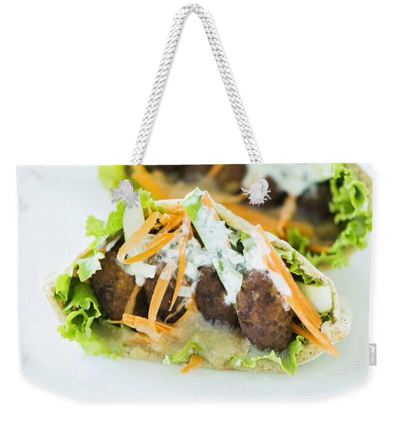 Bread Weekender Tote Bag featuring the photograph Vegetarian Falafel In Pita Bread Sandwich by JM Travel Photography