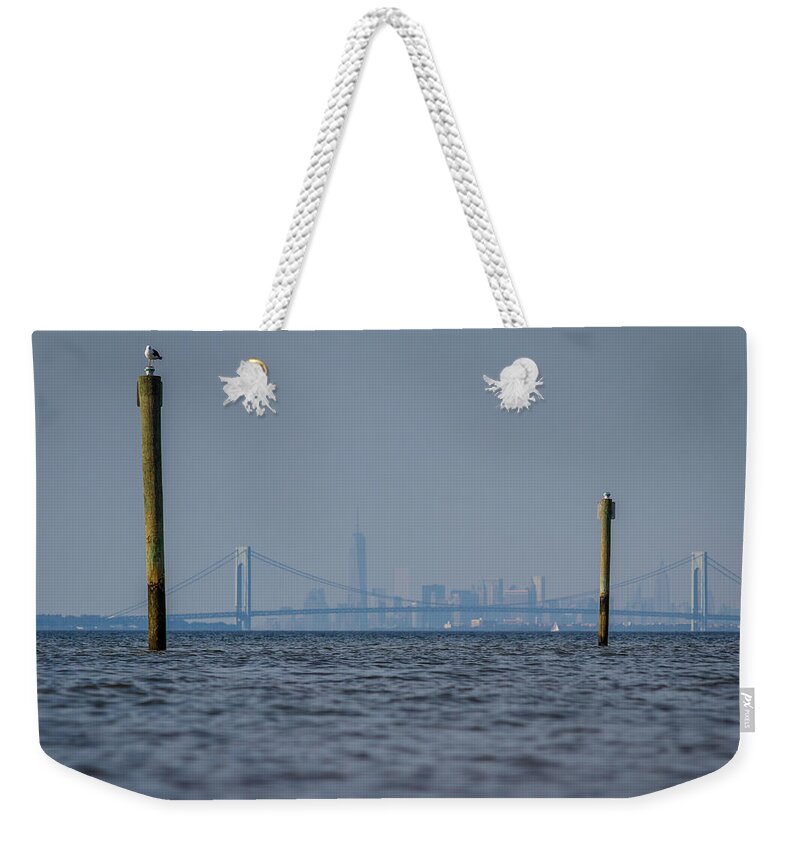 Bayshore Waterfront Weekender Tote Bag featuring the photograph Verrazano-Narrows bridge and NYC skyline from Port Monmouth by SAURAVphoto Online Store