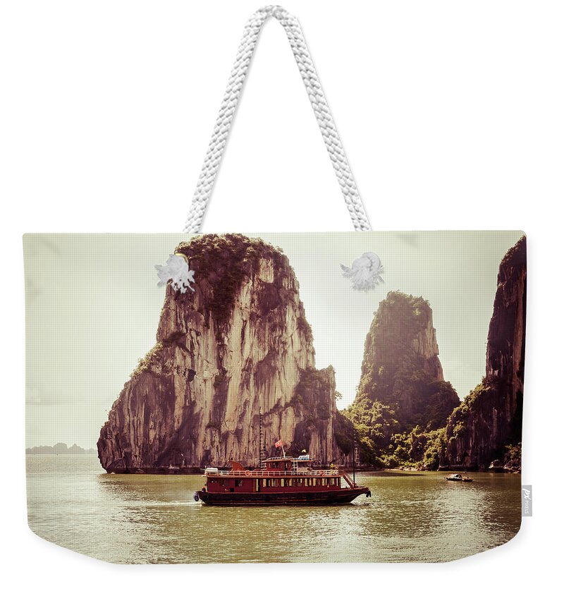 Scenics Weekender Tote Bag featuring the photograph Vietnamese Junk Cruising On Halong Bay by Fototrav