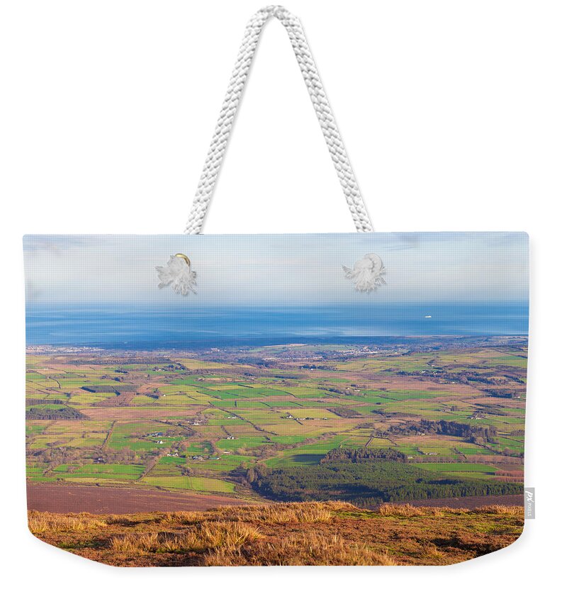 Blue Weekender Tote Bag featuring the photograph View from Djouce towards Bray and Greystones by Semmick Photo