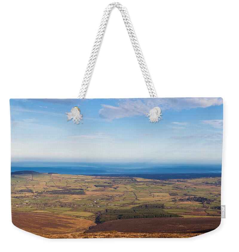 Blue Weekender Tote Bag featuring the photograph View towards Greystones from Djouce Mountain by Semmick Photo