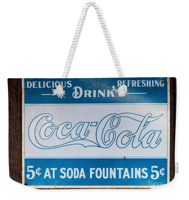 Coca Weekender Tote Bag featuring the photograph Vintage Coca Cola ad by Les Palenik