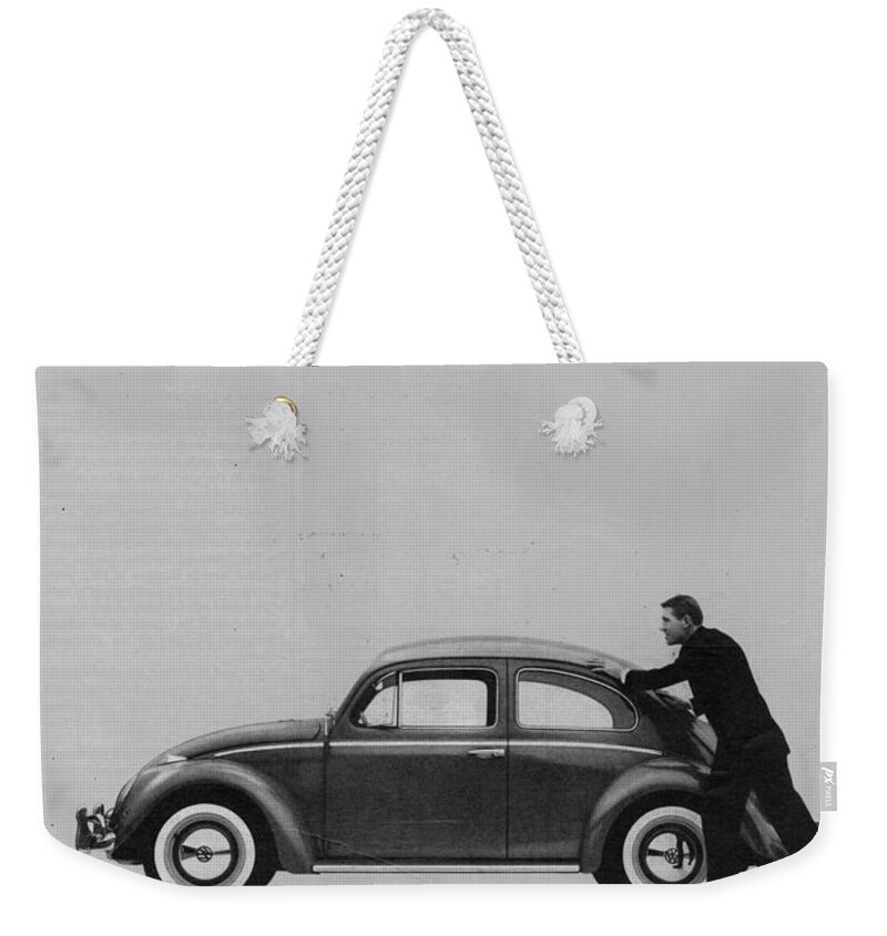 Vw Beetle Weekender Tote Bag featuring the digital art VW Beetle Advert 1962 - And if you run out of gas it's easy to push by Georgia Fowler