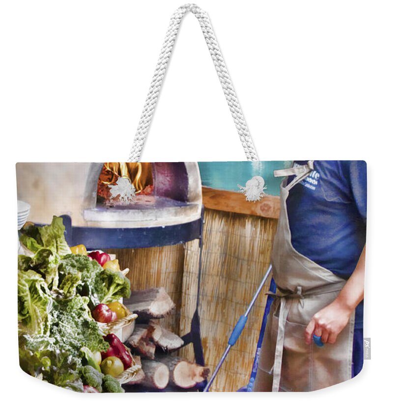 Warming The Pizza Oven Weekender Tote Bag featuring the photograph Warming the Pizza Oven by Chuck Staley