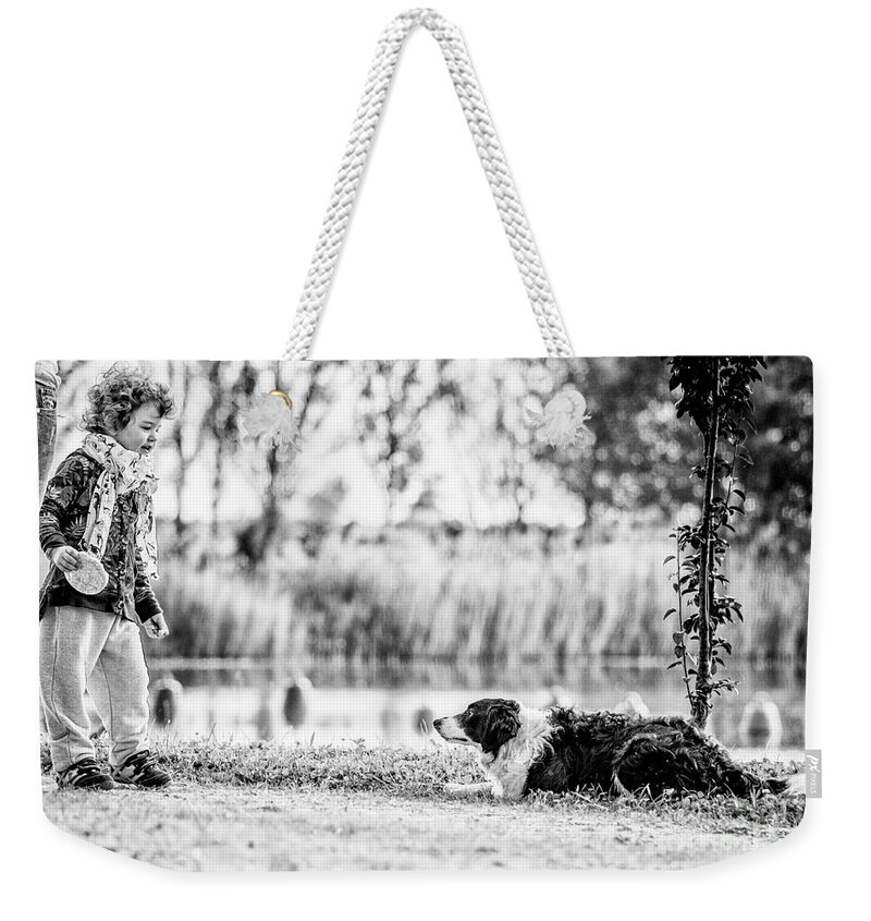 Child Weekender Tote Bag featuring the photograph We live as we dream by Traven Milovich
