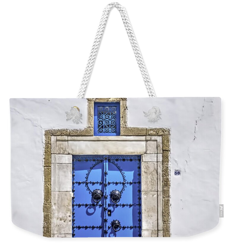 Africa Weekender Tote Bag featuring the photograph White and Blue by Maria Coulson