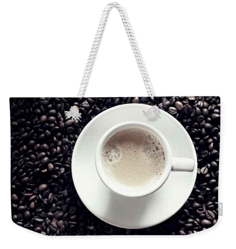 Large Group Of Objects Weekender Tote Bag featuring the photograph White Coffee Cup In Middle Of Coffee by Lacaosa