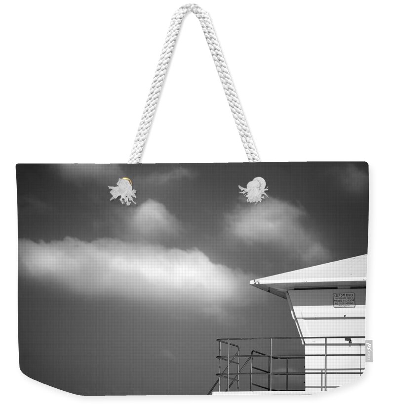 Beach Weekender Tote Bag featuring the photograph White Tower White Cloud by Peter Tellone