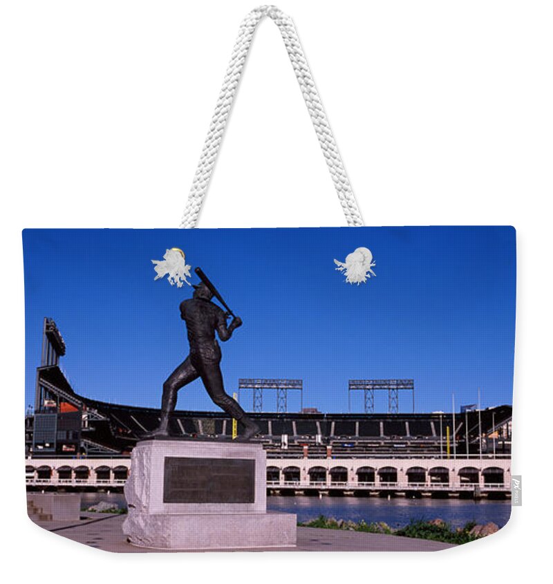 Photography Weekender Tote Bag featuring the photograph Willie Mays Statue In Front by Panoramic Images